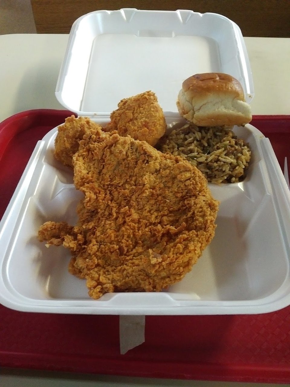 Drive-through chicken restaurant with simple storefront.